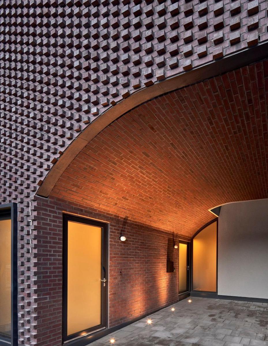 Image of a red bricked archway at the High Park Residence