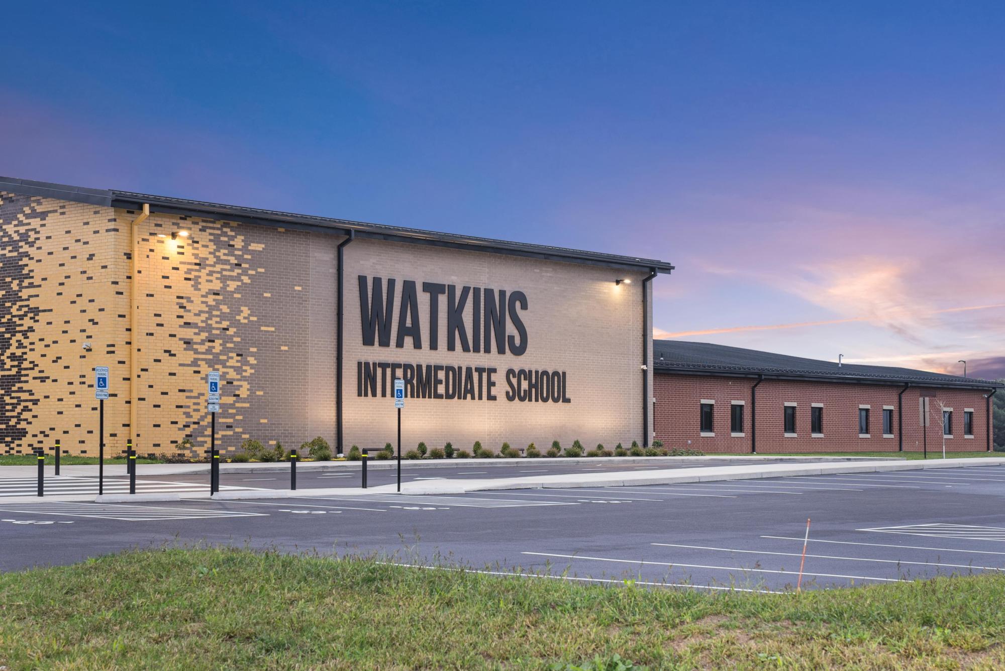 Watkins Elementary School is patterned with darker brick within beige, with the occasional red brick wall