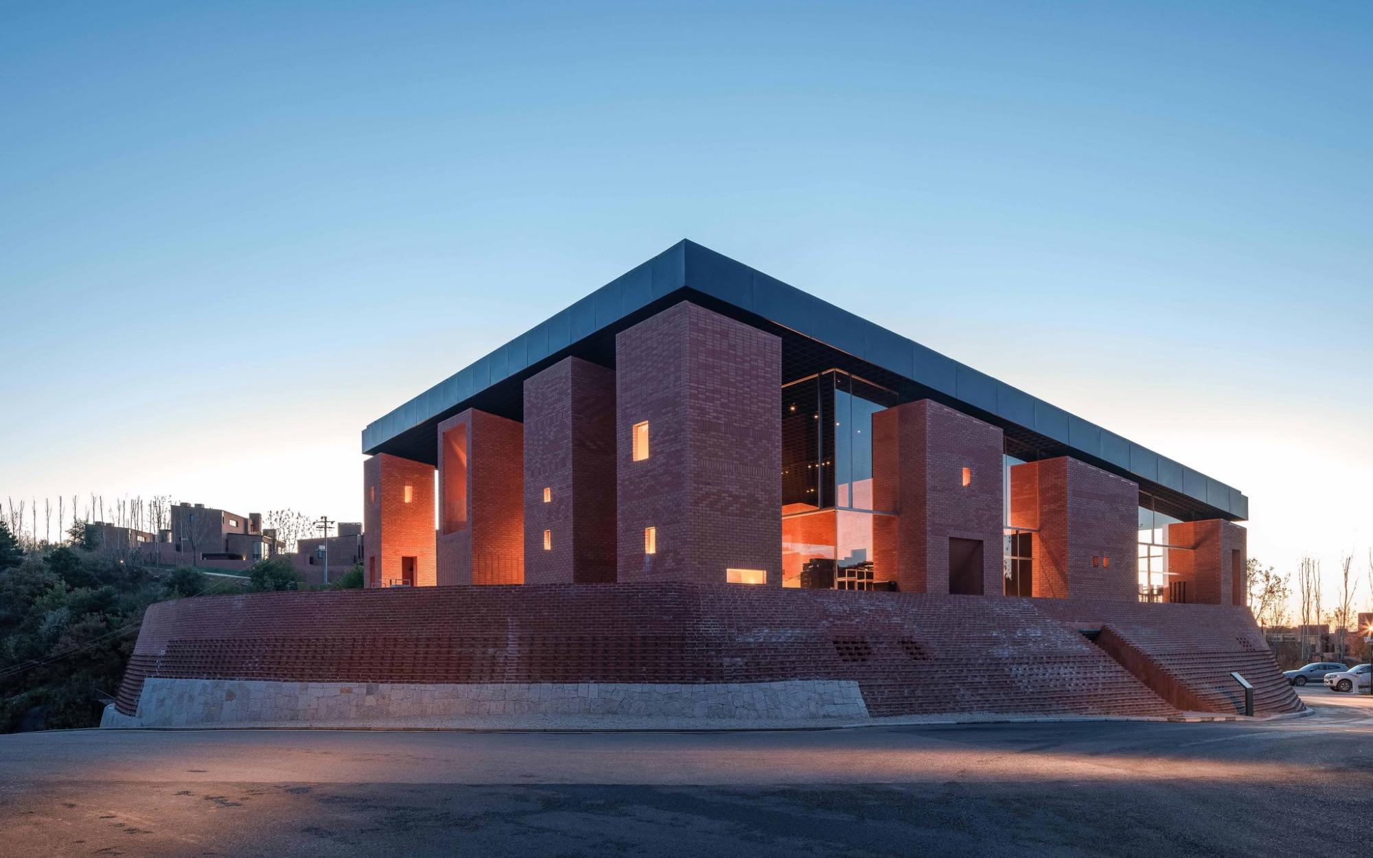 The red brick exterior of the Art Center of Aranya